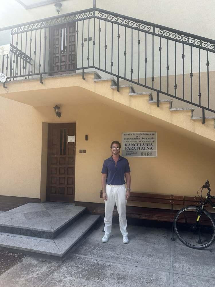 Zach at the door of the Pysznica parish office